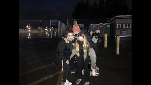 Landrey Mccann and her teammates celebrate after a home soccer game.