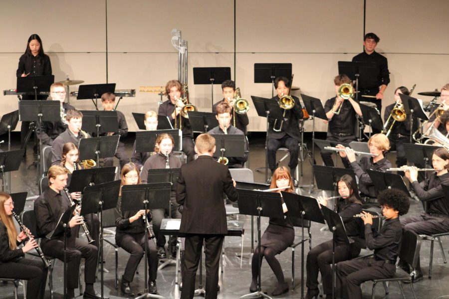 Student teacher Ben Martin leads the combined Concert and Symphonic Bands.