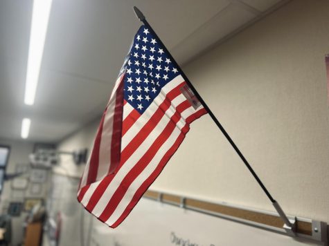 A flag at the front of classroom 904. Though a flag is displayed in the morning announcements, most classrooms have a physical flag as well.
