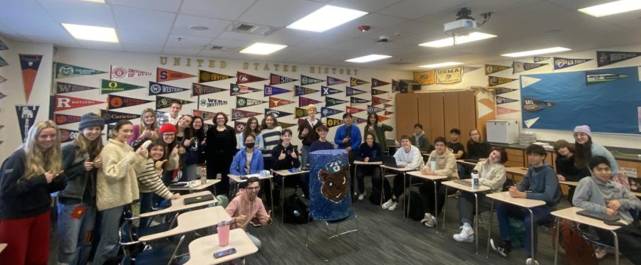 Mr. Schaefer's class poses with the 'big can' after winning the daily 'cans per student' total.