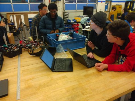 Members of the robotics club work on a project.