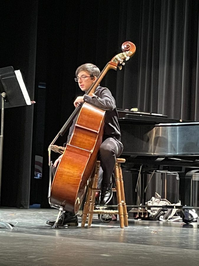 Oscar Terrell, bassist and 2nd alternate for state, listens as a judge comments on his performance. 
