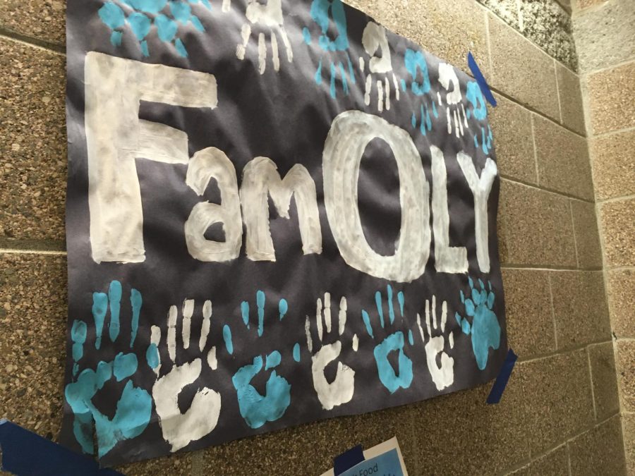 The message of FamOLY captured through a poster in the 300s hallway.