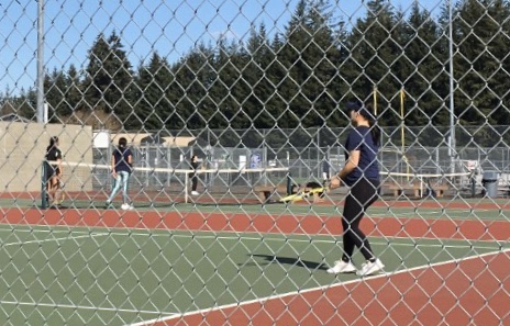 Sophomore Chloe Song warms up before her singles match. She played a flawless game, winning 6-0 and 6-0. 