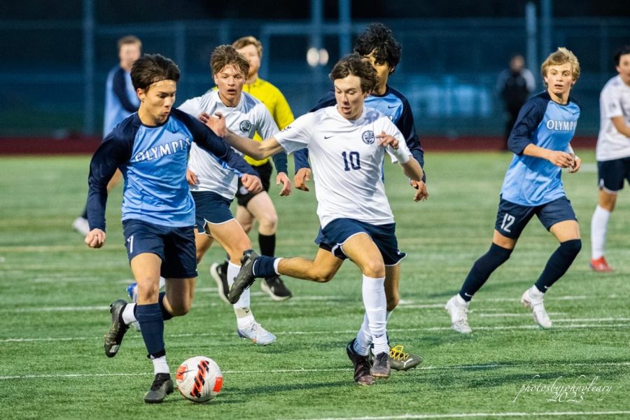 Obi Bruce quickly dribbles the ball down the field. Photos courtesy of: John OLeary