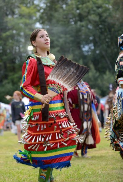 Animikiikwe Durant dancing in traditional jingle dress, performing in 2022 Seattle powwow