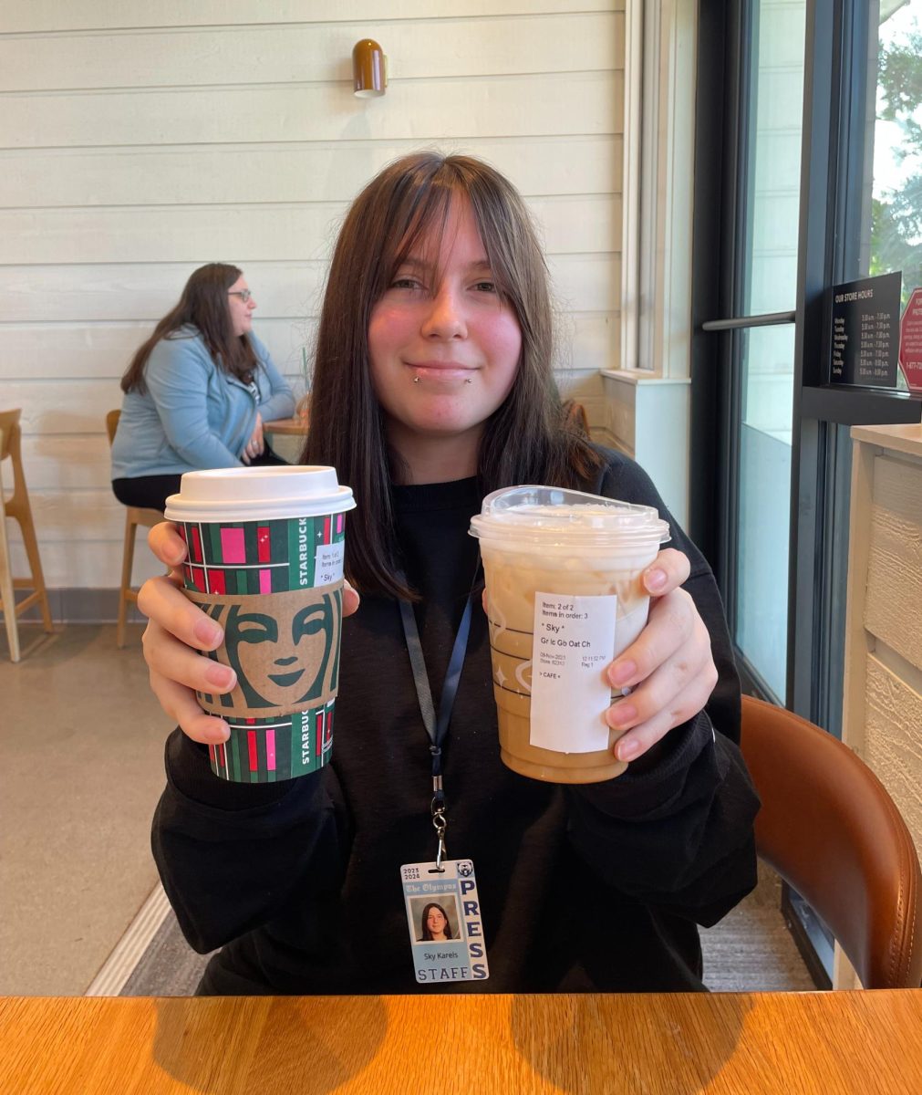 Journalist Sky Karels enjoying her Oleato™ Gingerbread Oatmilk Latte and Iced Gingerbread Oatmilk Chai Latte. 