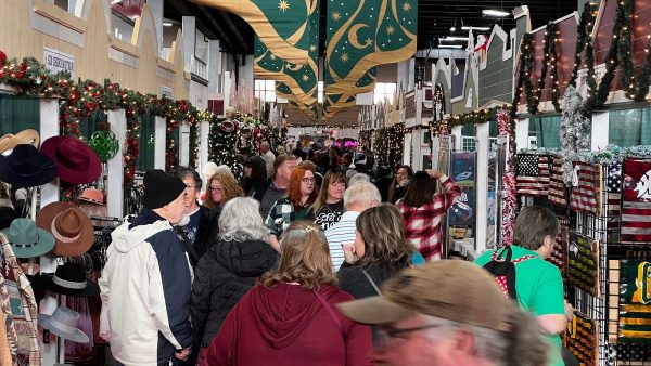 Hustle and bustle around the many booths and vendors set up throughout the Thurston County Fairgrounds in preparation for upcoming winter season