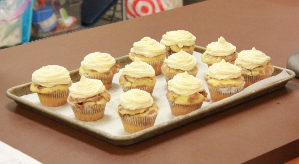 Freshly baked snickerdoodle muffins complete with rich buttercream frosting. Their sweet, spicy aroma quickly spread throughout the entire classroom.