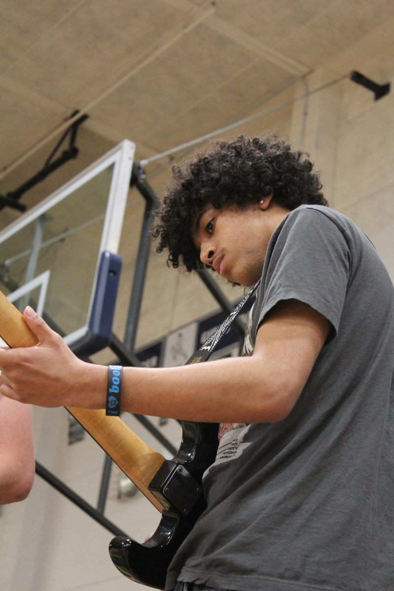 Freshman Jacob Mitchell shows off his talent during guitar class’s performance of Weezer’s “Island in the Sun.”  The crowd soon joined in singing along, creating a memorable moment. 