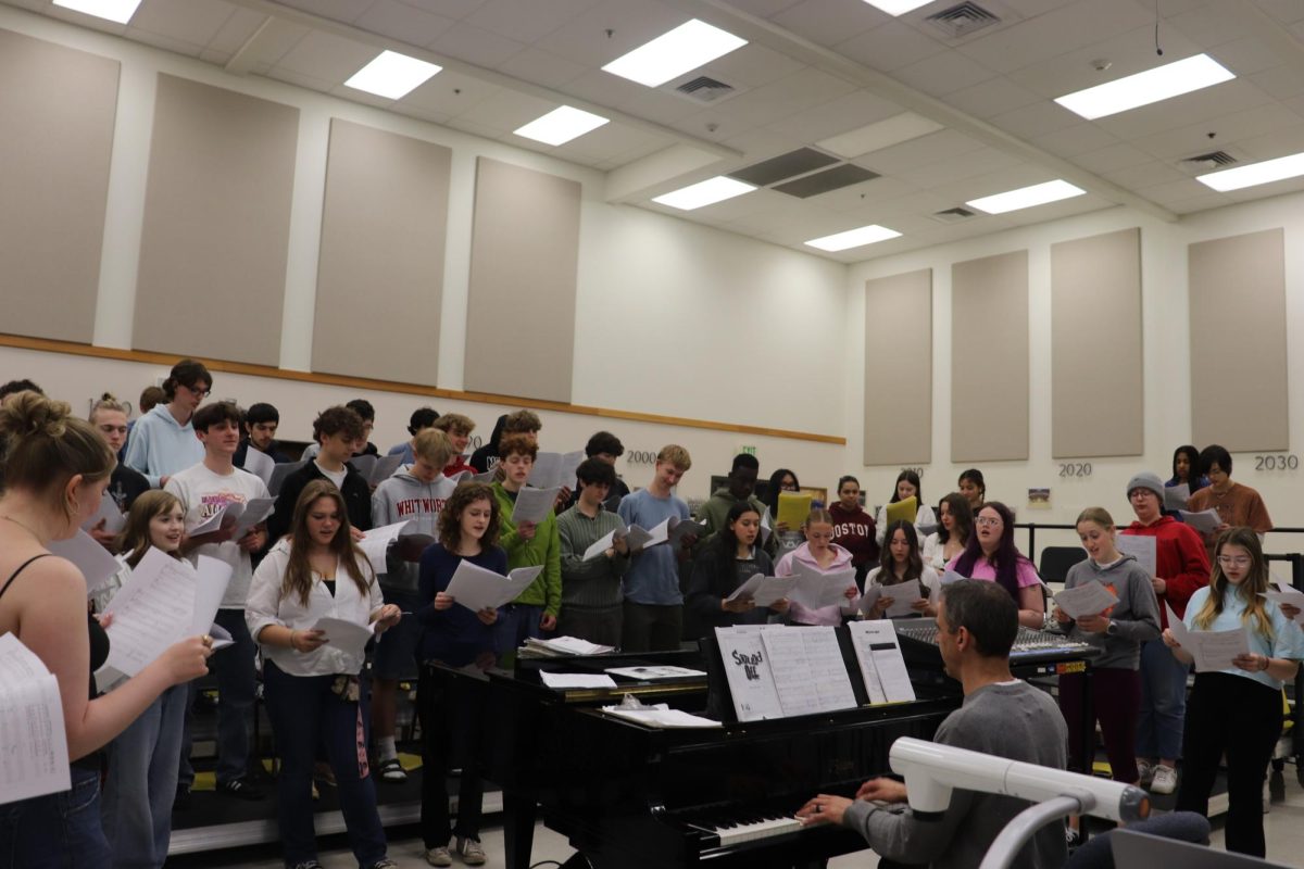 Olympia High School’s Symphonic Choir rehearses “Africa” by Toto, one of the many fun songs that will be performed at their concert on June 5. 