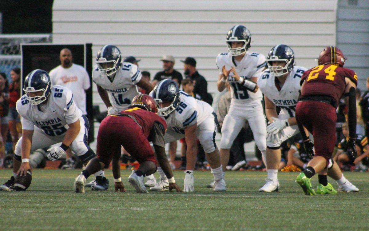 Tucker Downing gets ready to take a snap as the Bears fight their way back in the first half of the game.