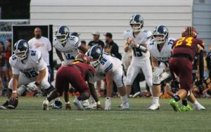 Tucker Downing gets ready to take a snap as the Bears fight their way back in the first half of the game.