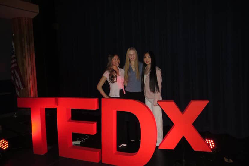 Susanna Yan, Meika Lindgren, and Clare Lanese pose after their amazing presentations about autism stigma and the importance of compliments.