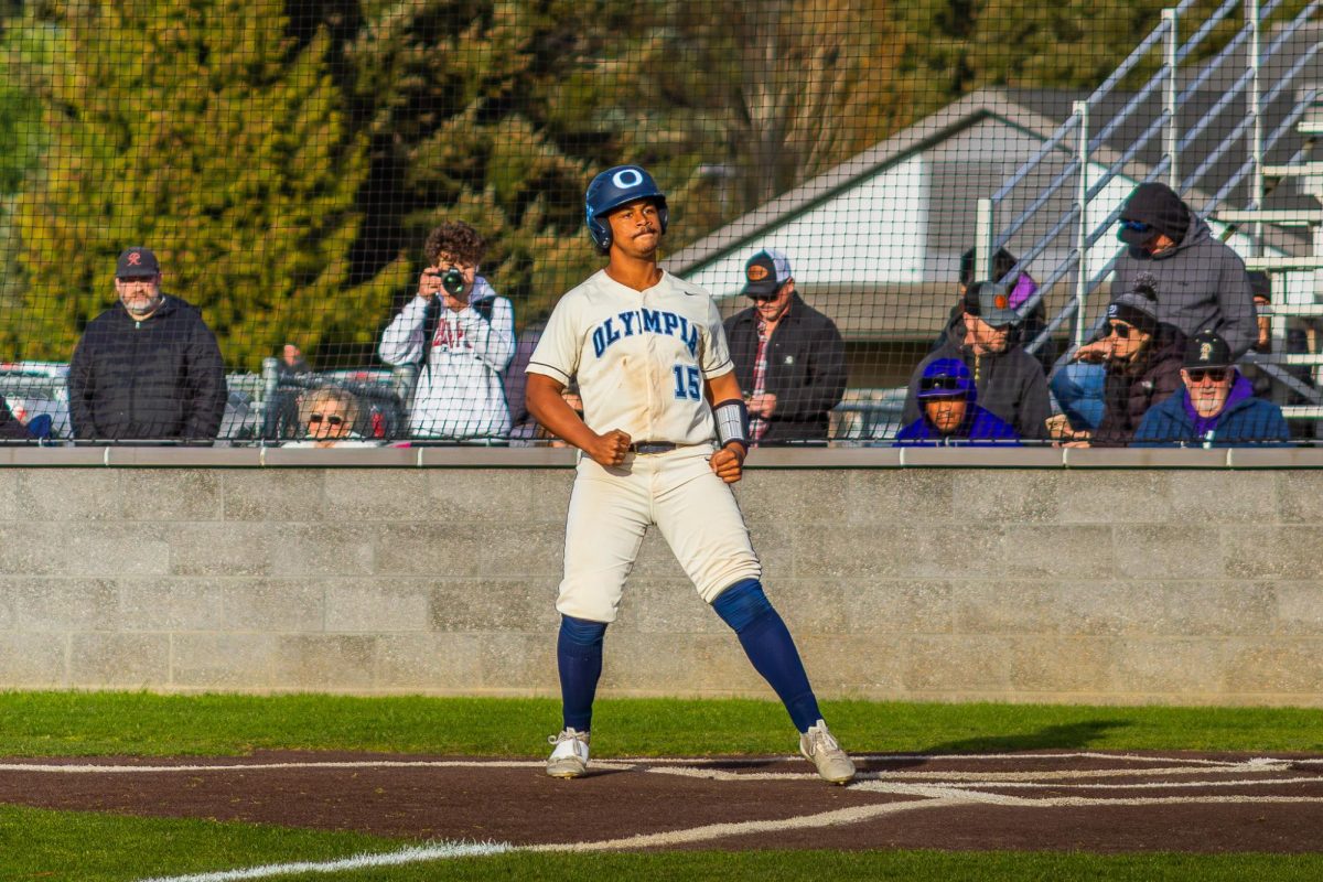 Freshman Elijah Butler celebrates before taking a free base. When asked how he’s able to stay calm in the batter’s box, he said,”It's just what I do.”